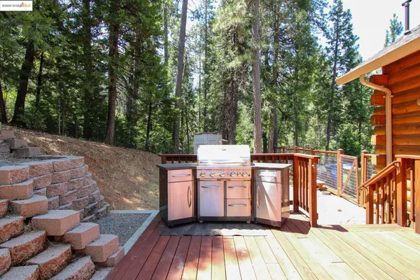 a view of a deck with a sink and wooden floor
