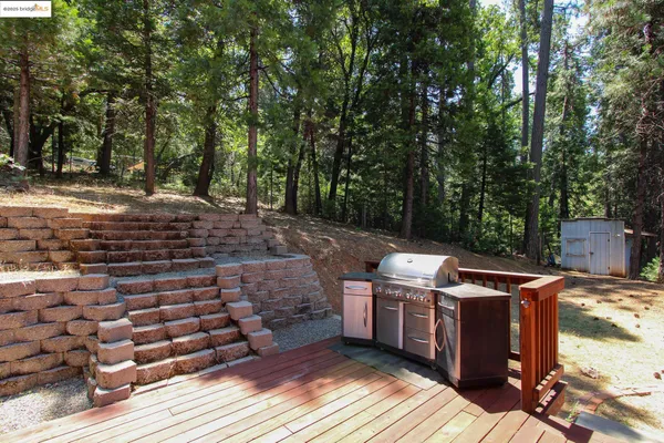 a view of a backyard with sitting area