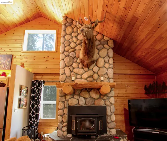 a view of a fireplace with wooden floor