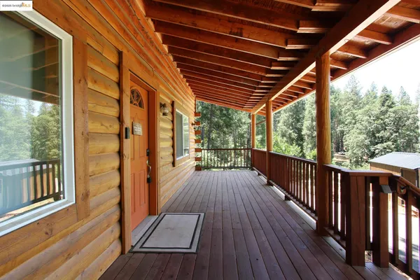 a view of balcony with wooden floor