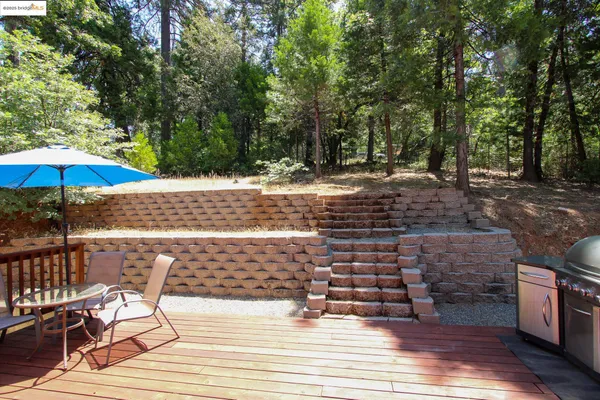 a view of a backyard with sitting area