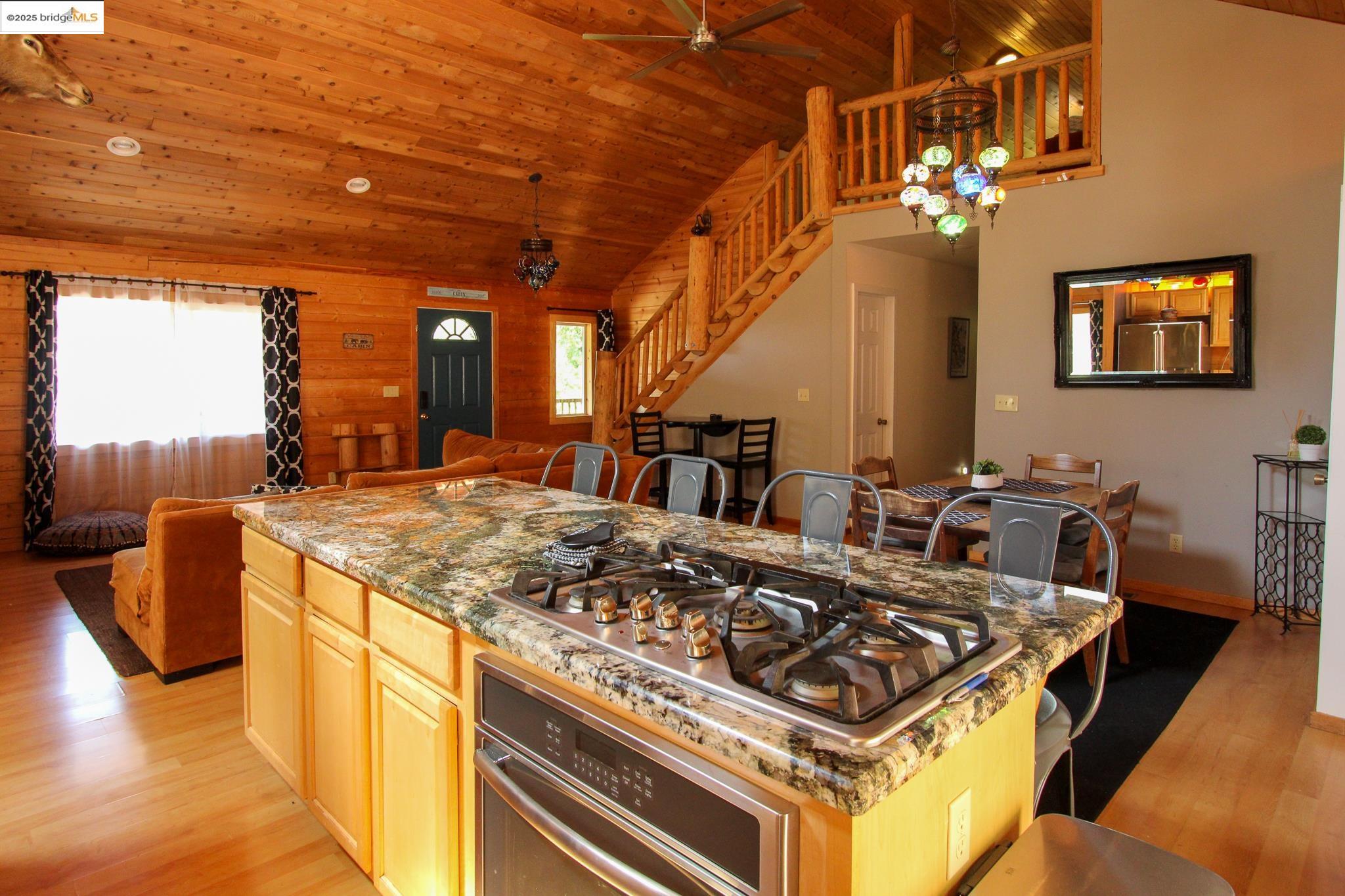 2936 Highway 4 Murphys, CA 95247 - Photo 25 of 41 a kitchen with a stove and a chandelier
