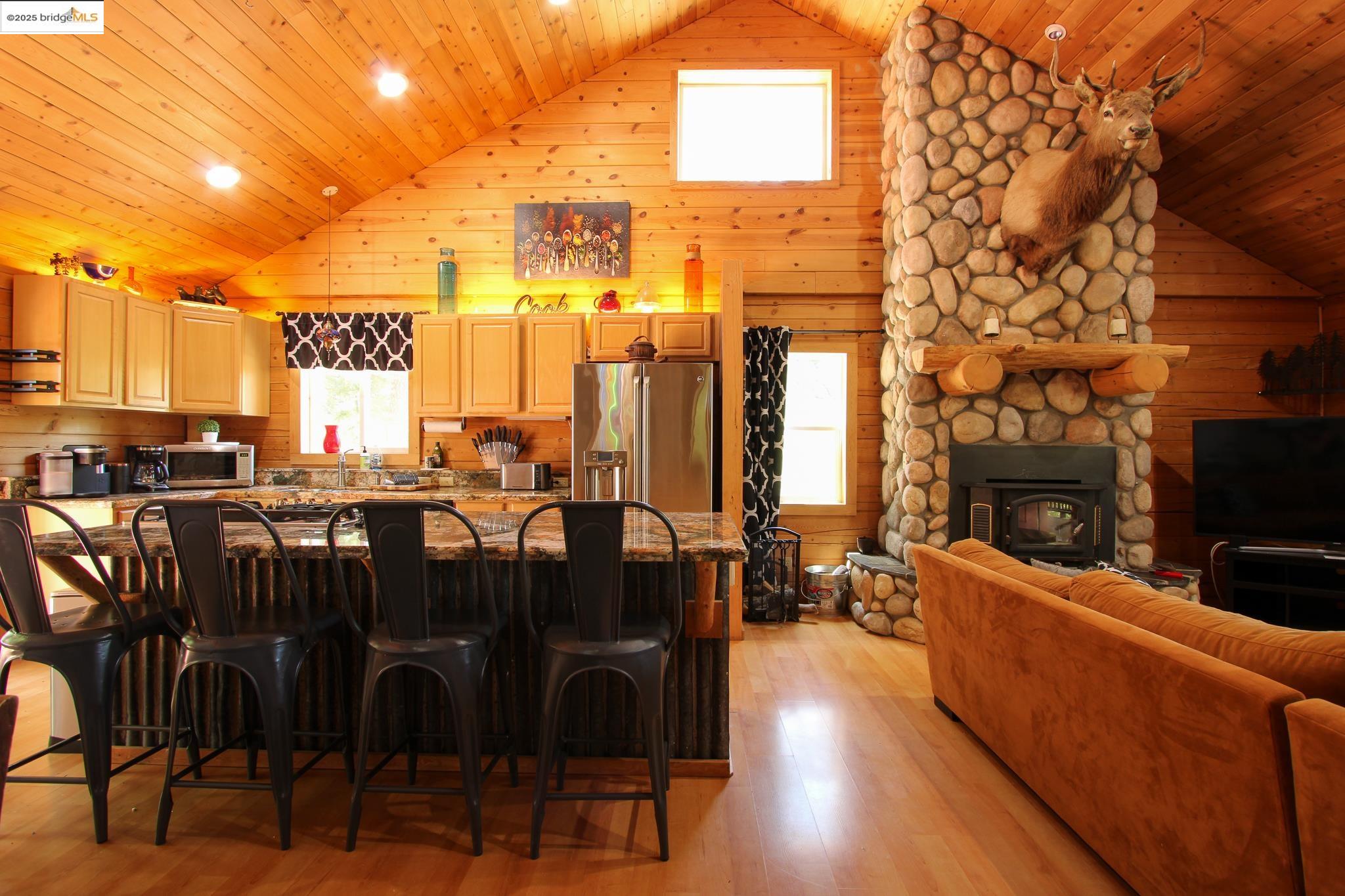 2936 Highway 4 Murphys, CA 95247 - Photo 27 of 41 a view of a patio with dining table and chairs with wooden floor