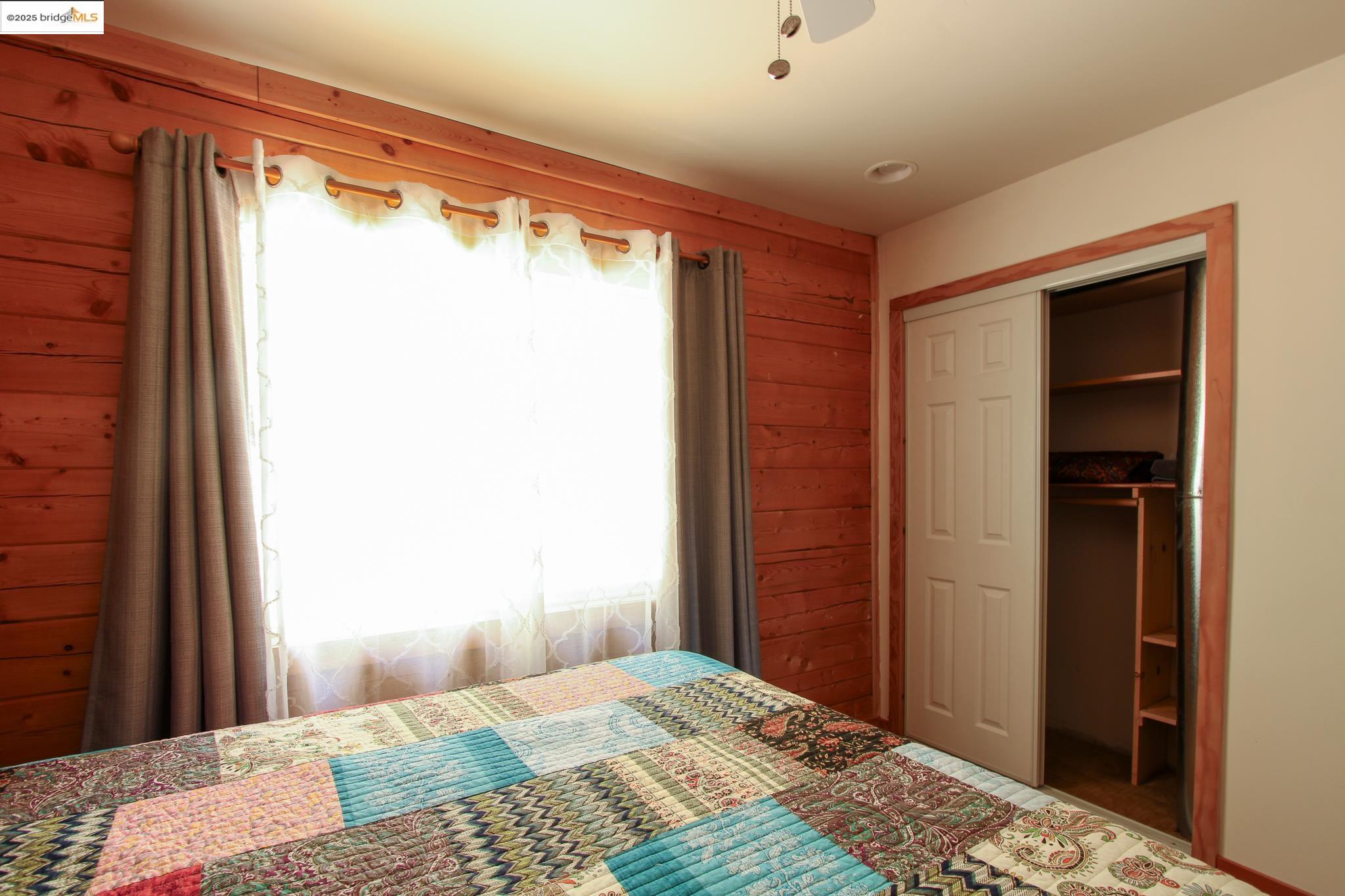 2936 Highway 4 Murphys, CA 95247 - Photo 30 of 41 a bedroom with a bed and a window