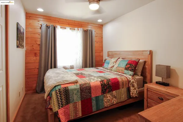 a bedroom with a bed and window