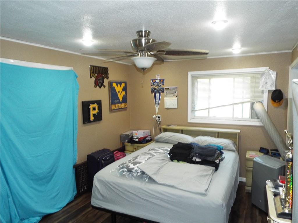 2524 2nd Street Grindstone, PA 15442 - Photo 17 of 30 a bedroom with a bed and a chandelier