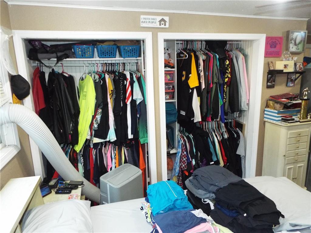 2524 2nd Street Grindstone, PA 15442 - Photo 21 of 30 a view of walk in closet with clothes and shoes
