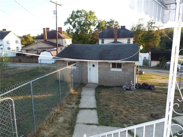 a balcony with table and chairs