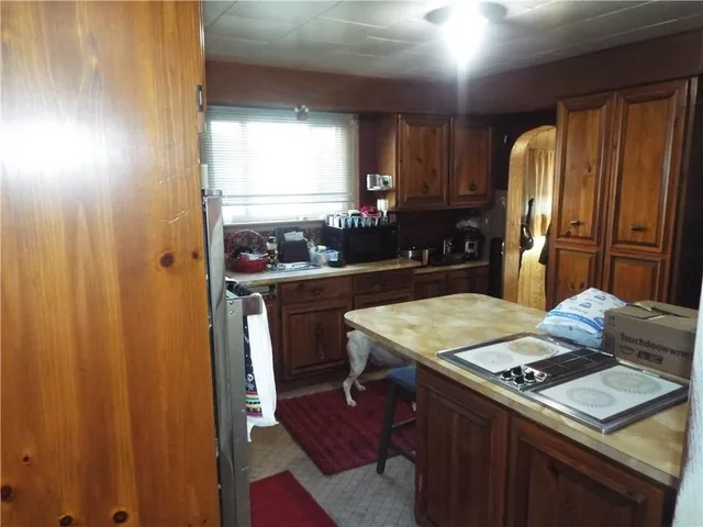 a kitchen with stainless steel appliances granite countertop a sink and cabinets