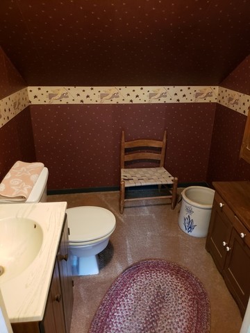 12721 Coleta Road Sterling, IL 61081 - Photo 14 of 35 a bathroom with a toilet and a sink