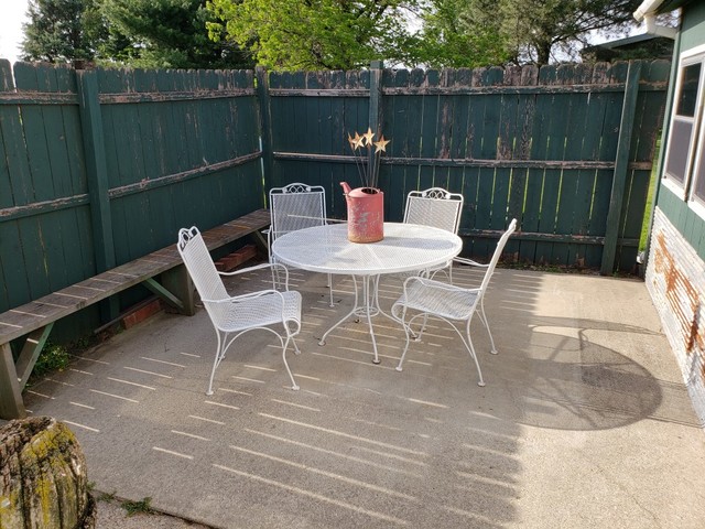 12721 Coleta Road Sterling, IL 61081 - Photo 24 of 35 a patio with a table and chairs