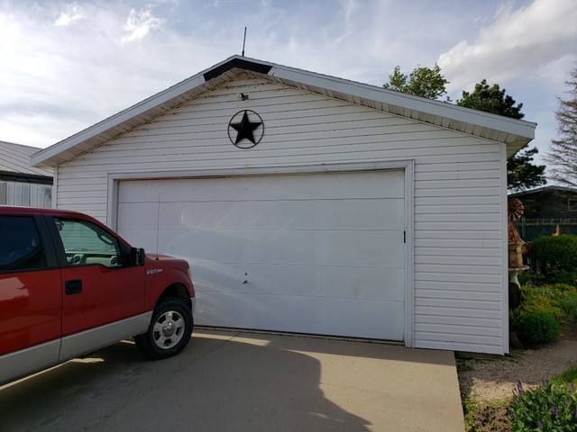 12721 Coleta Road Sterling, IL 61081 - Photo 25 of 35 a car parked in front of a house