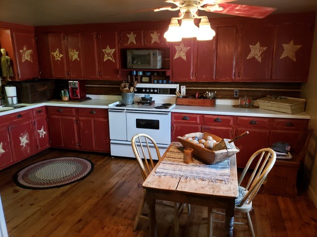 12721 Coleta Road Sterling, IL 61081 - Photo 4 of 35 a kitchen with a stove a sink and a refrigerator