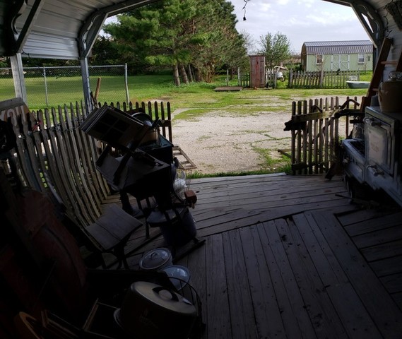 12721 Coleta Road Sterling, IL 61081 - Photo 32 of 35 a view of a wooden deck with a yard