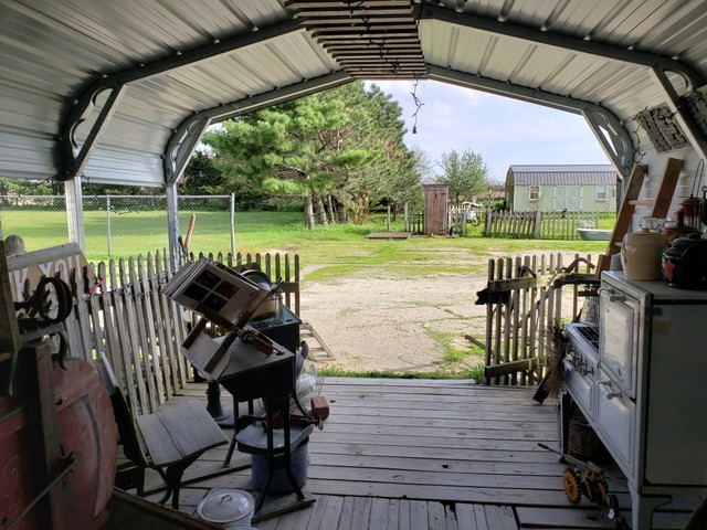 12721 Coleta Road Sterling, IL 61081 - Photo 34 of 35 a view of a chairs and table in patio with a lake view