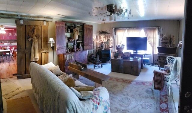 12721 Coleta Road Sterling, IL 61081 - Photo 7 of 35 a living room with furniture and a flat screen tv