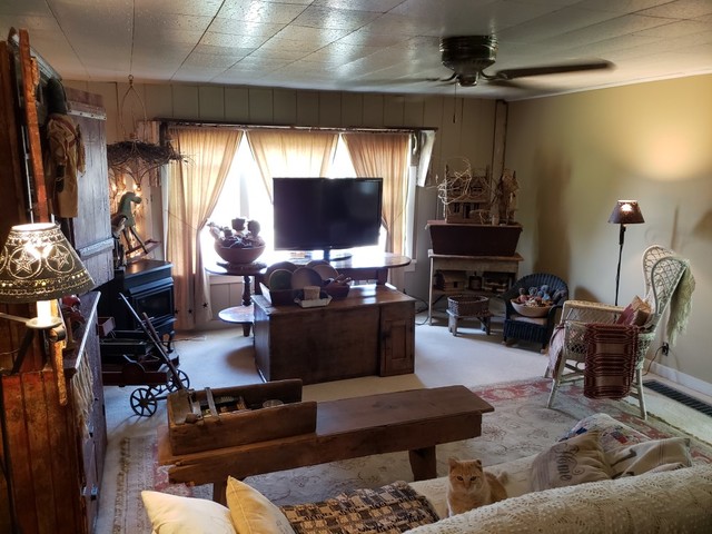 12721 Coleta Road Sterling, IL 61081 - Photo 8 of 35 a living room with furniture and a flat screen tv