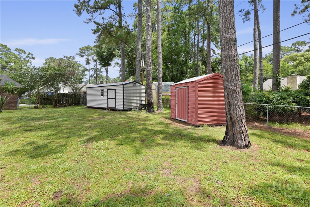 13609 Rockingham Road Savannah, GA 31419 - Photo 33 of 39 Huge fenced rear yard showing 2 of 3 storage sheds