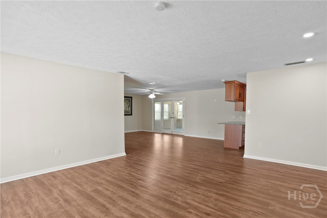 13609 Rockingham Road Savannah, GA 31419 - Photo 10 of 39 Living room with vinyl plank flooring