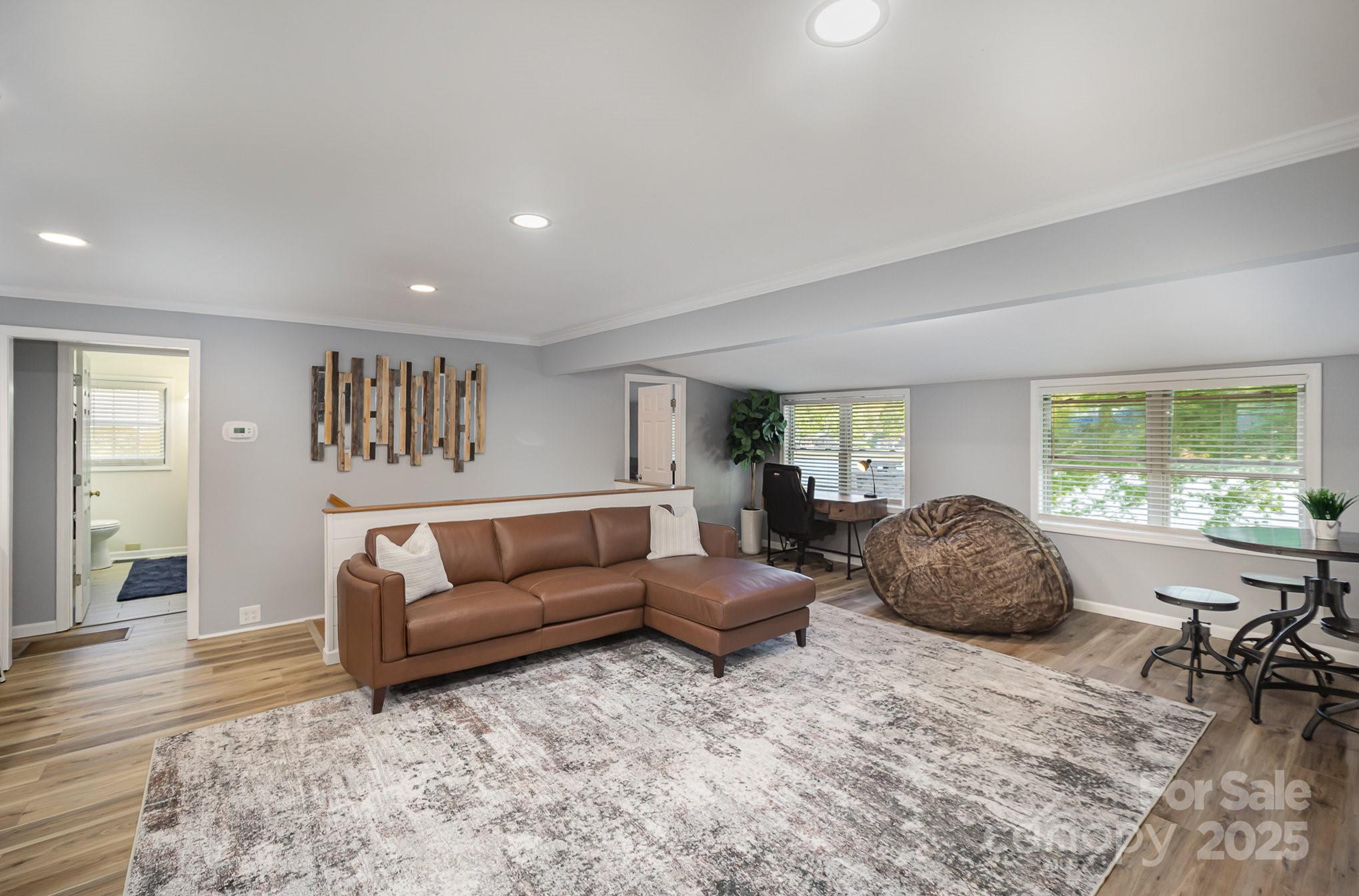 1435 Panther Point Road Richfield, NC 28137 - Photo 12 of 31 a living room with furniture and a large window
