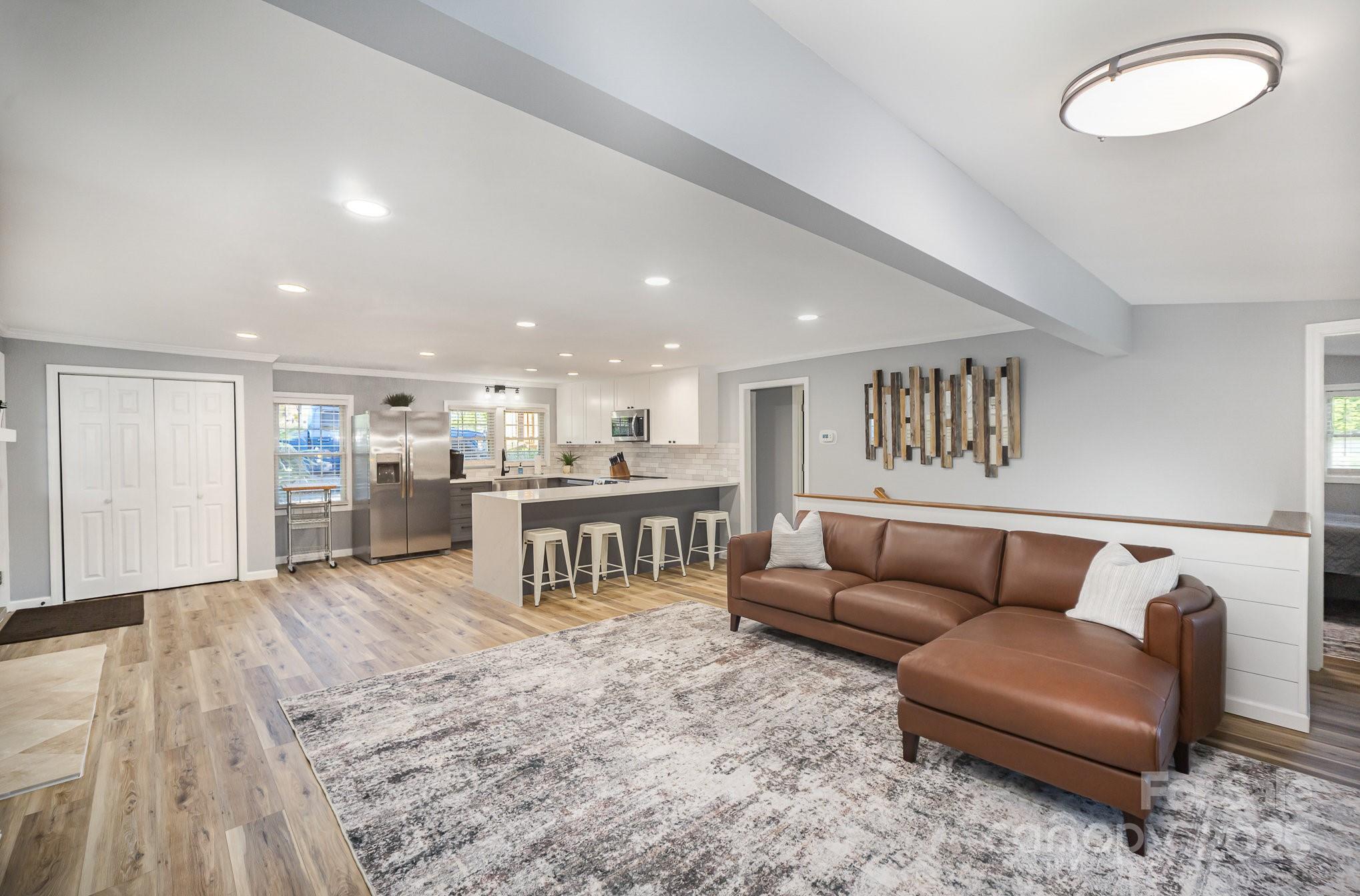 1435 Panther Point Road Richfield, NC 28137 - Photo 14 of 31 a living room with furniture and kitchen view