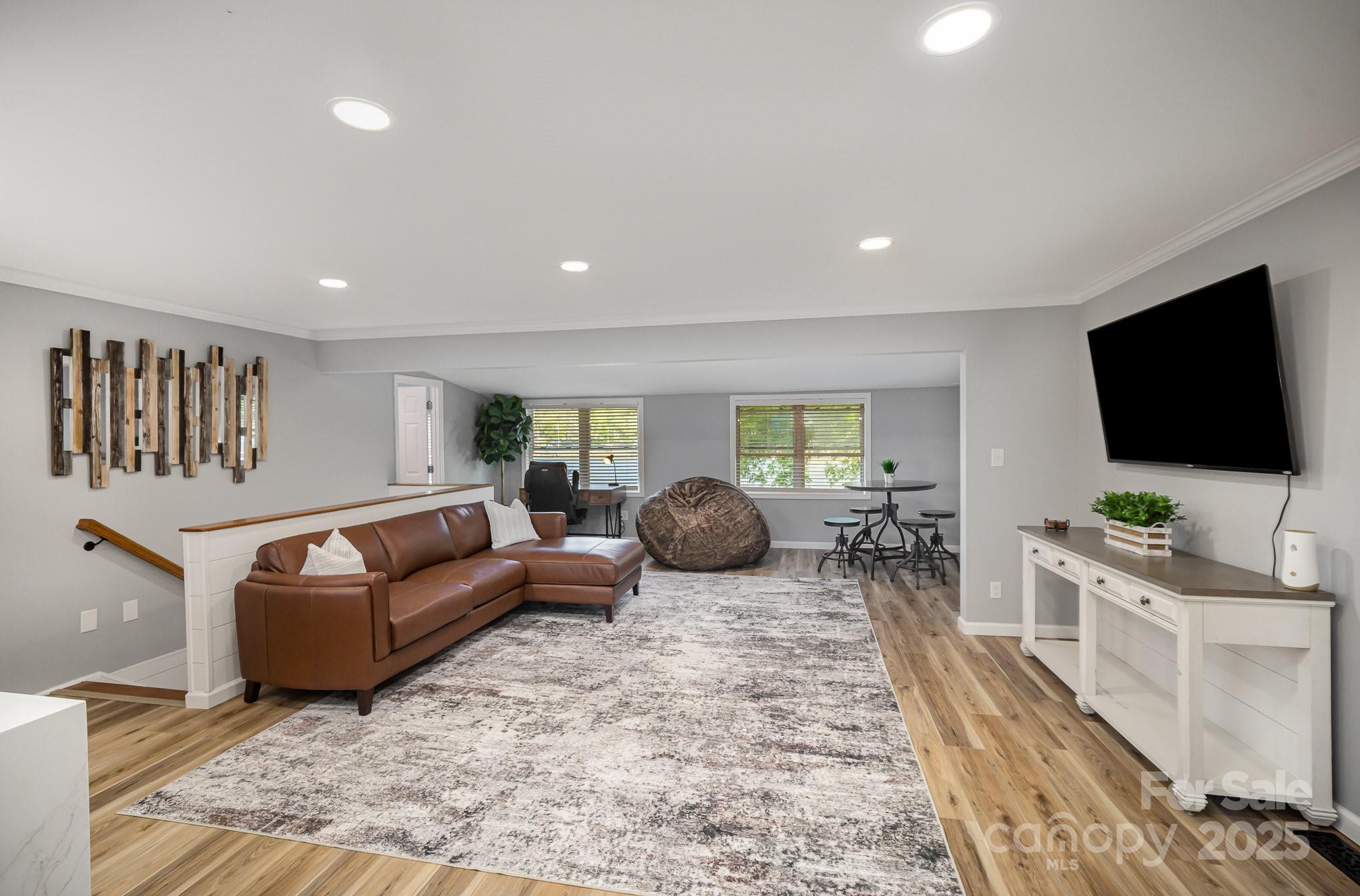 1435 Panther Point Road Richfield, NC 28137 - Photo 15 of 31 a living room with furniture and a flat screen tv