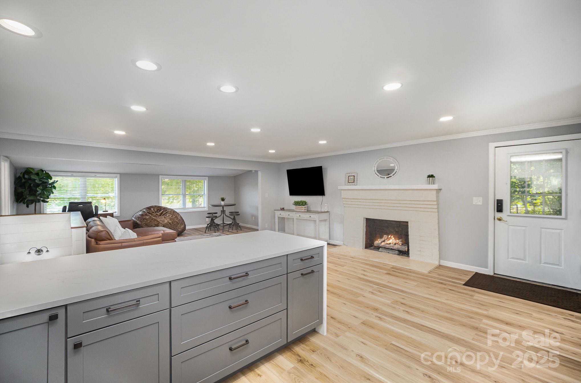 1435 Panther Point Road Richfield, NC 28137 - Photo 16 of 31 a spacious bedroom with a large bed and a flat screen tv
