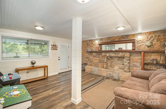 a view of a house with sitting area and garden