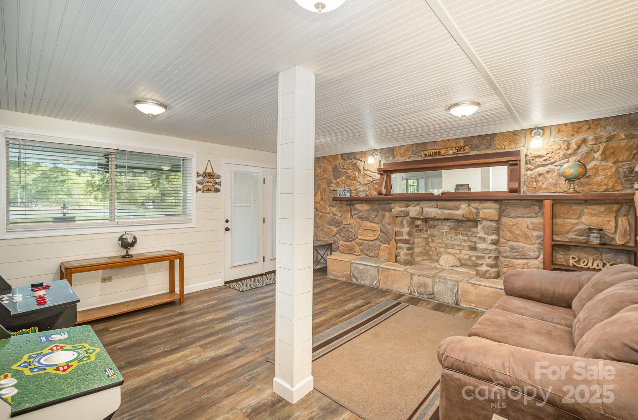 1435 Panther Point Road Richfield, NC 28137 - Photo 23 of 31 a living room with furniture and a large window