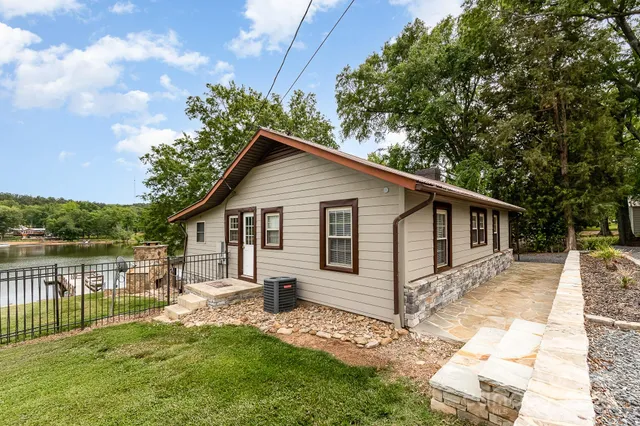a view of a patio with table and chairs