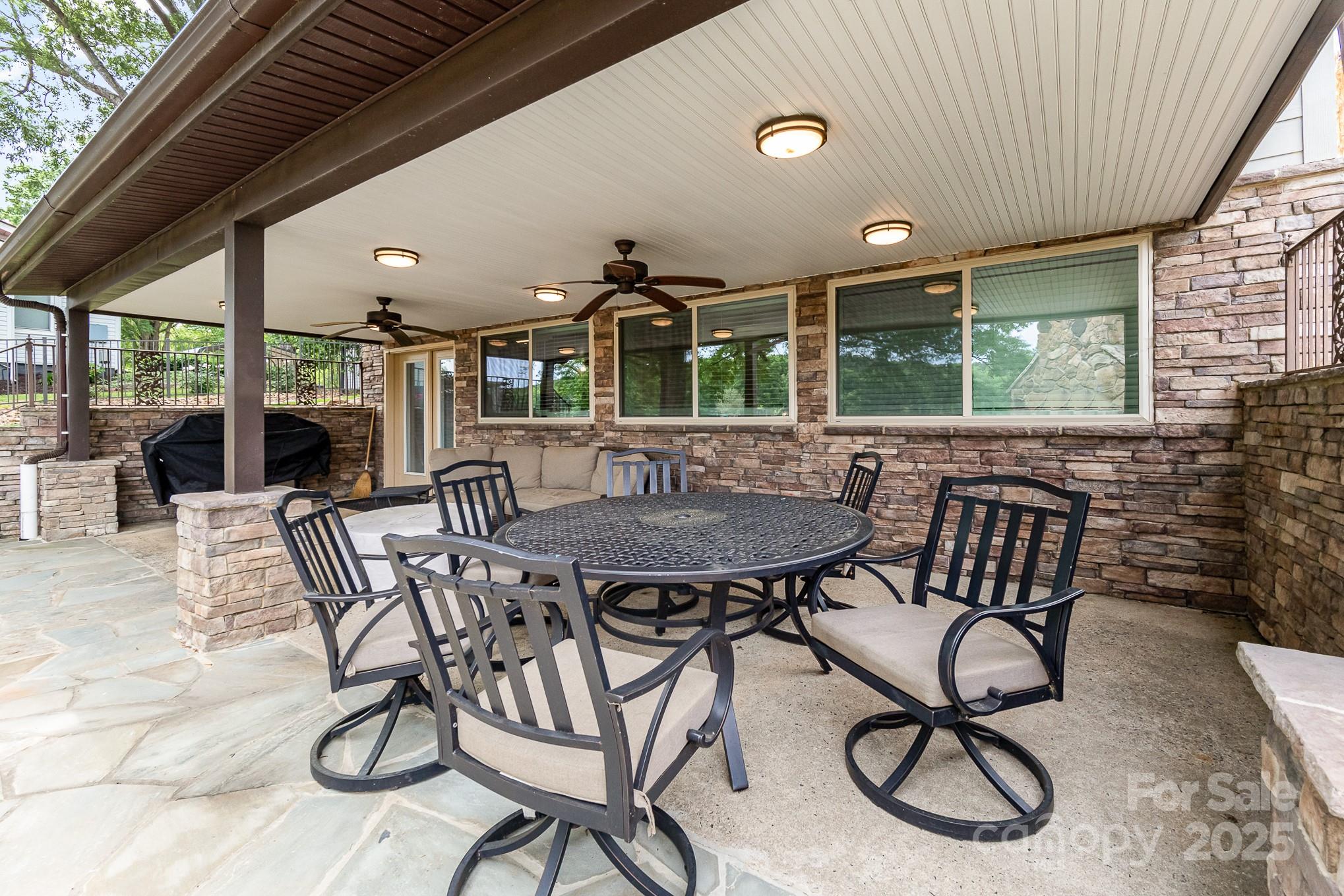 1435 Panther Point Road Richfield, NC 28137 - Photo 26 of 31 a view of a patio with table and chairs