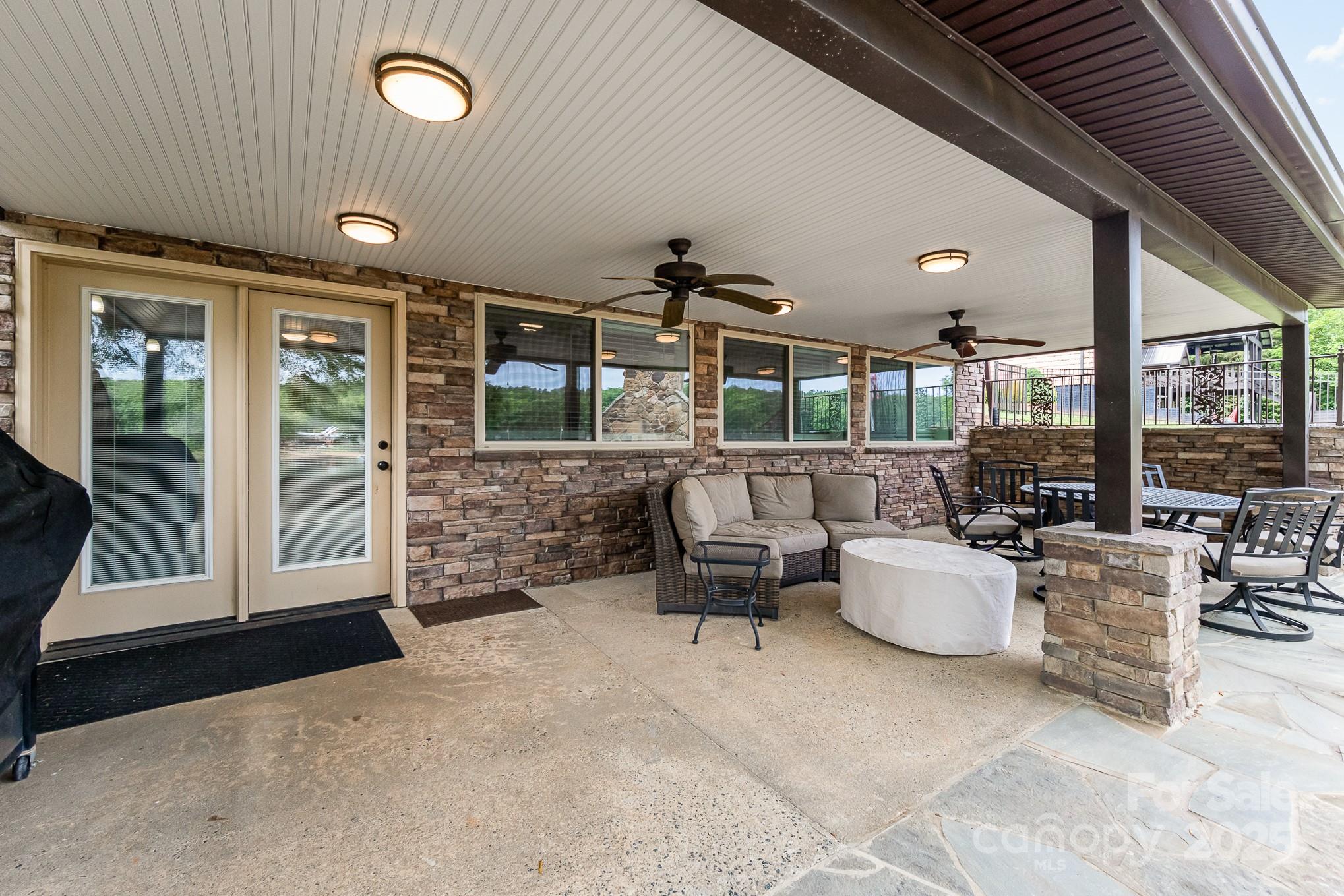 1435 Panther Point Road Richfield, NC 28137 - Photo 27 of 31 a living room with fireplace furniture and a large window