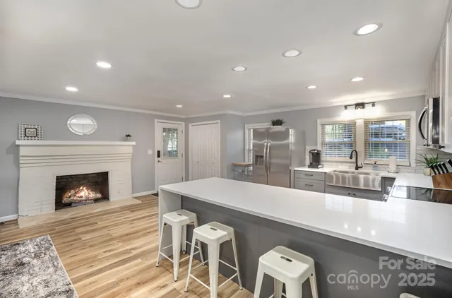 a view of empty room with a fireplace