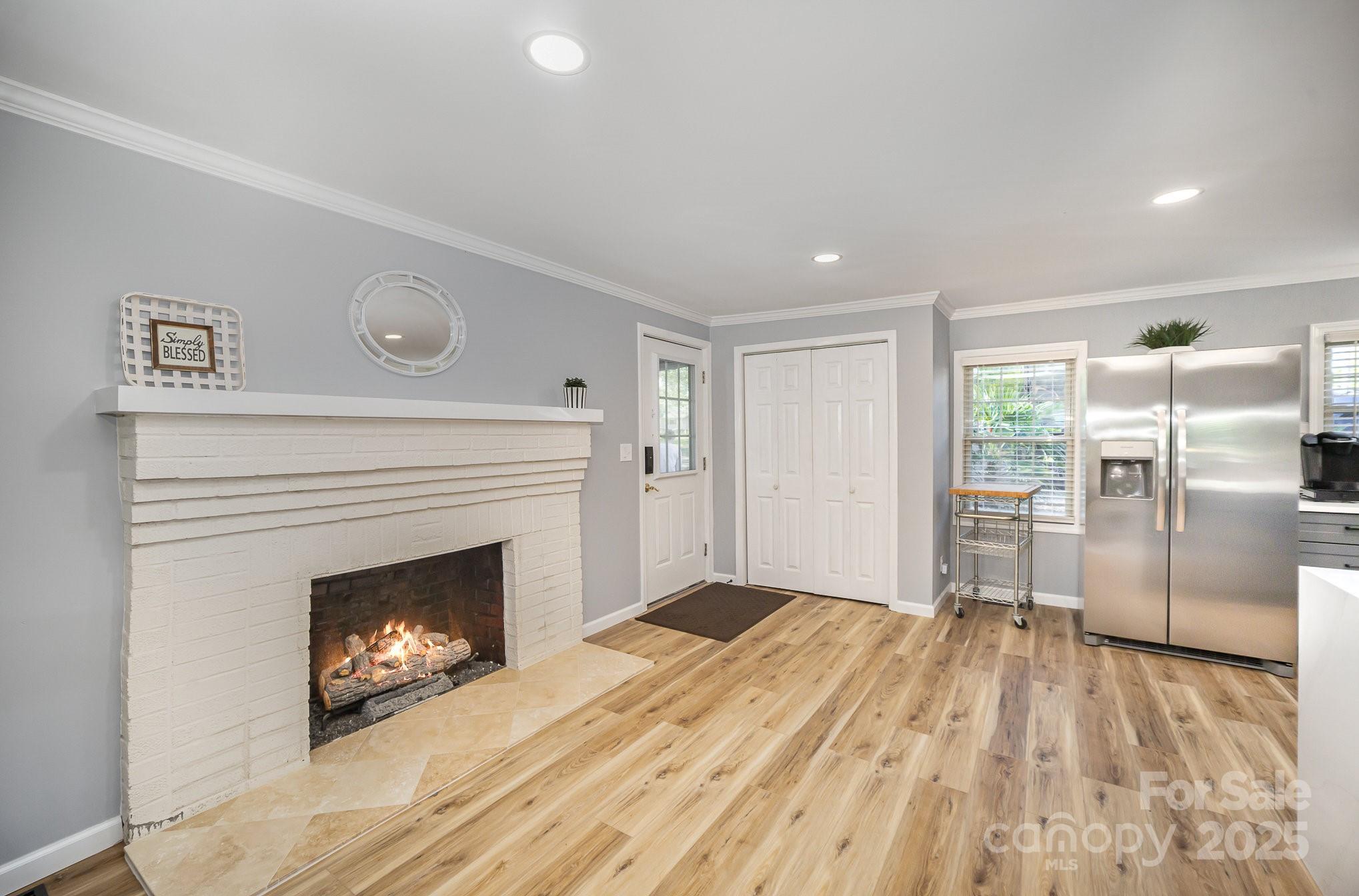 1435 Panther Point Road Richfield, NC 28137 - Photo 10 of 31 a view of empty room with a fireplace