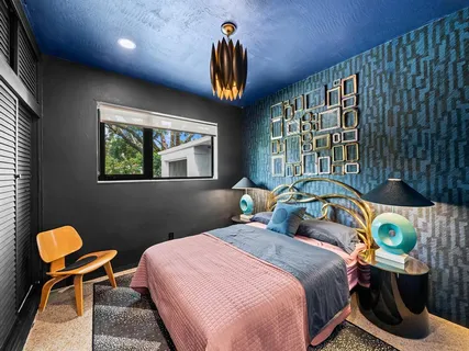 a bedroom with bed and window