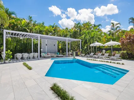 a view of a swimming pool with a patio