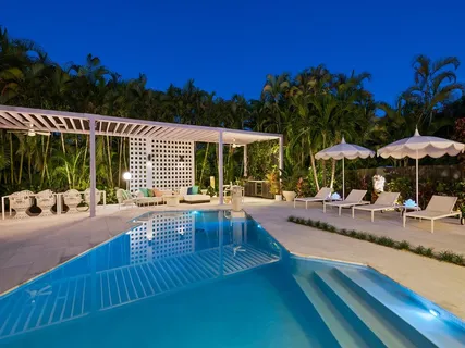 a view of swimming pool with outdoor seating