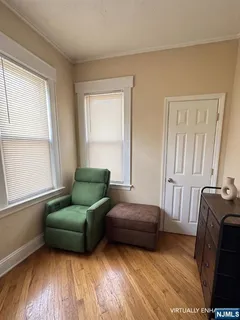 a bedroom with furniture and a window