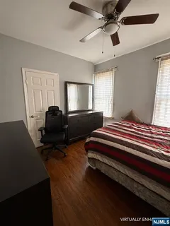 a bedroom with furniture and a window