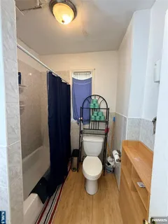 a bathroom with a toilet a sink and shower