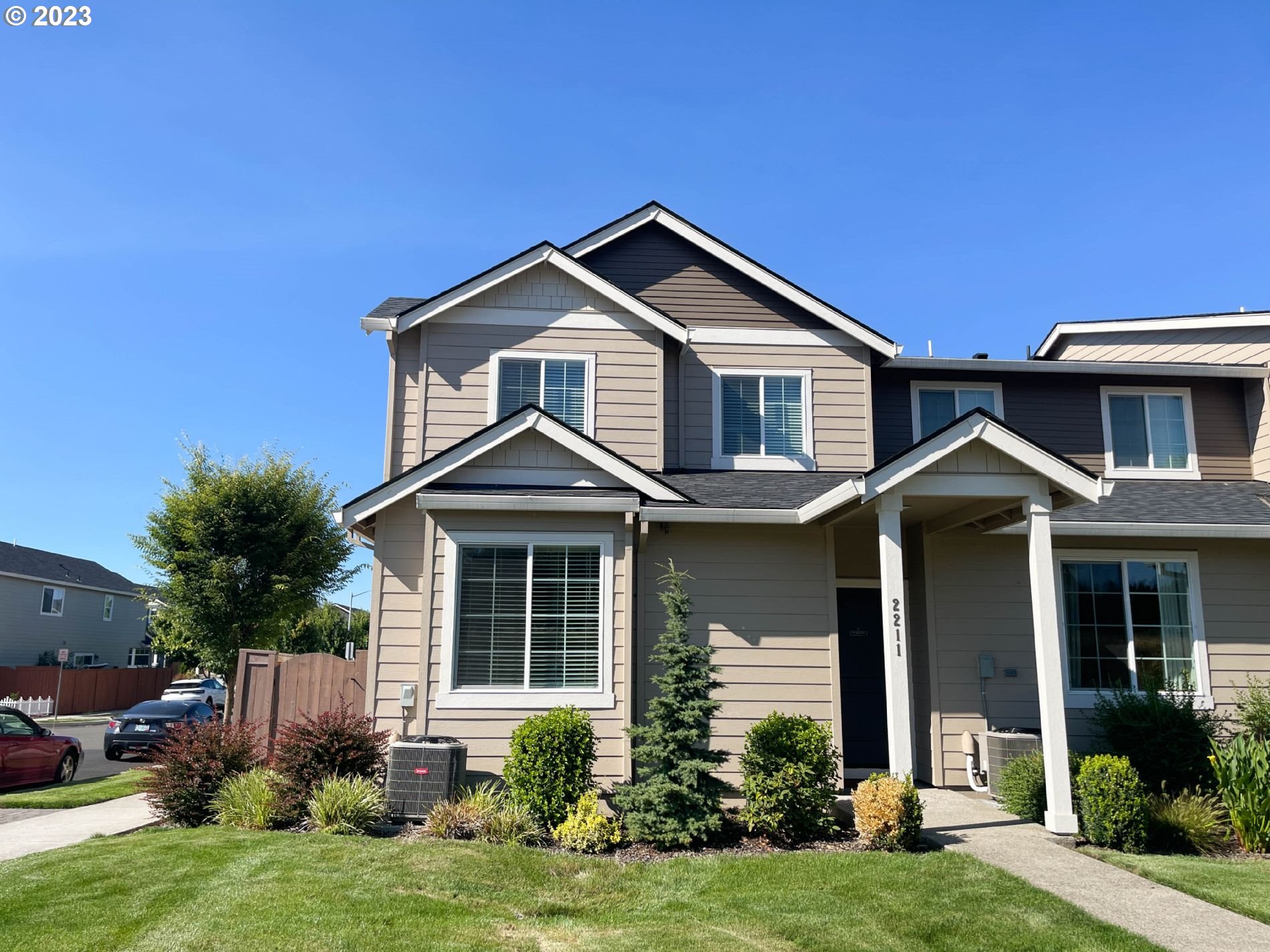 a front view of a house with a yard