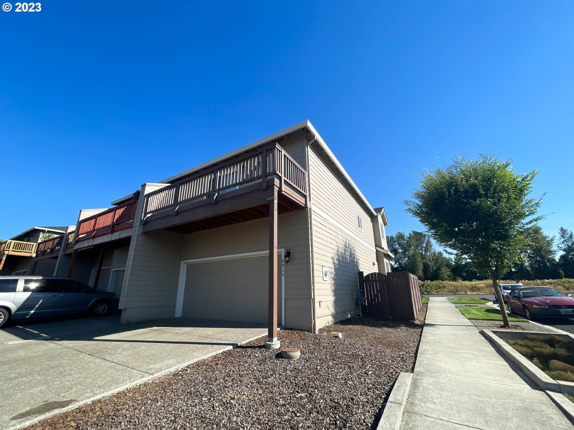 2211 Southeast 19th Street Gresham, OR 97080 - Photo 16 of 16 a front view of a house with a yard