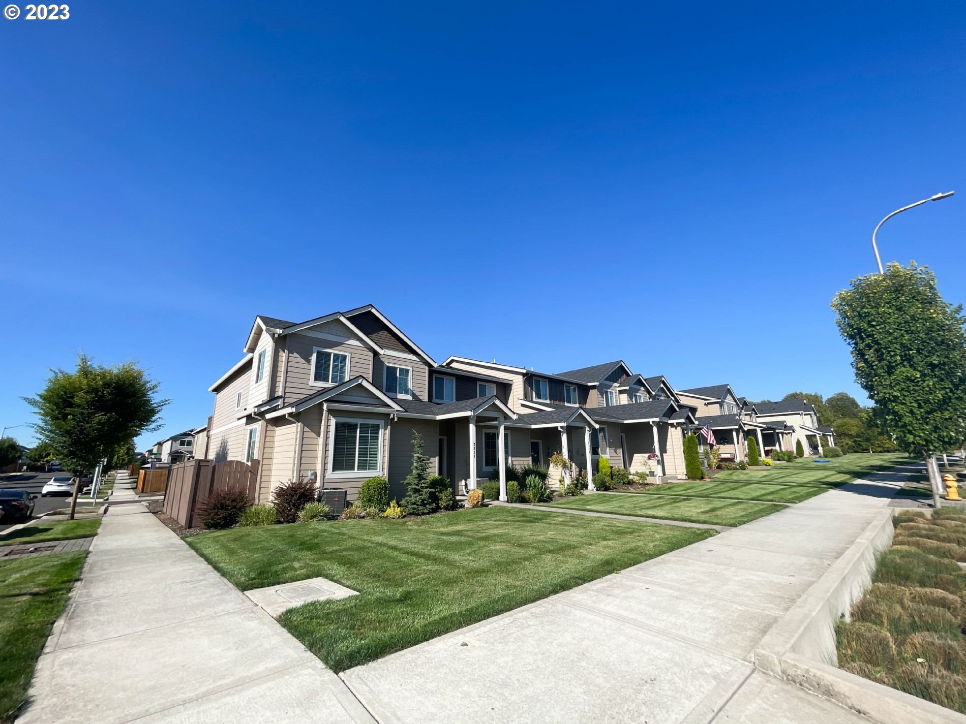 2211 Southeast 19th Street Gresham, OR 97080 - Photo 2 of 16 a front view of a house with a yard