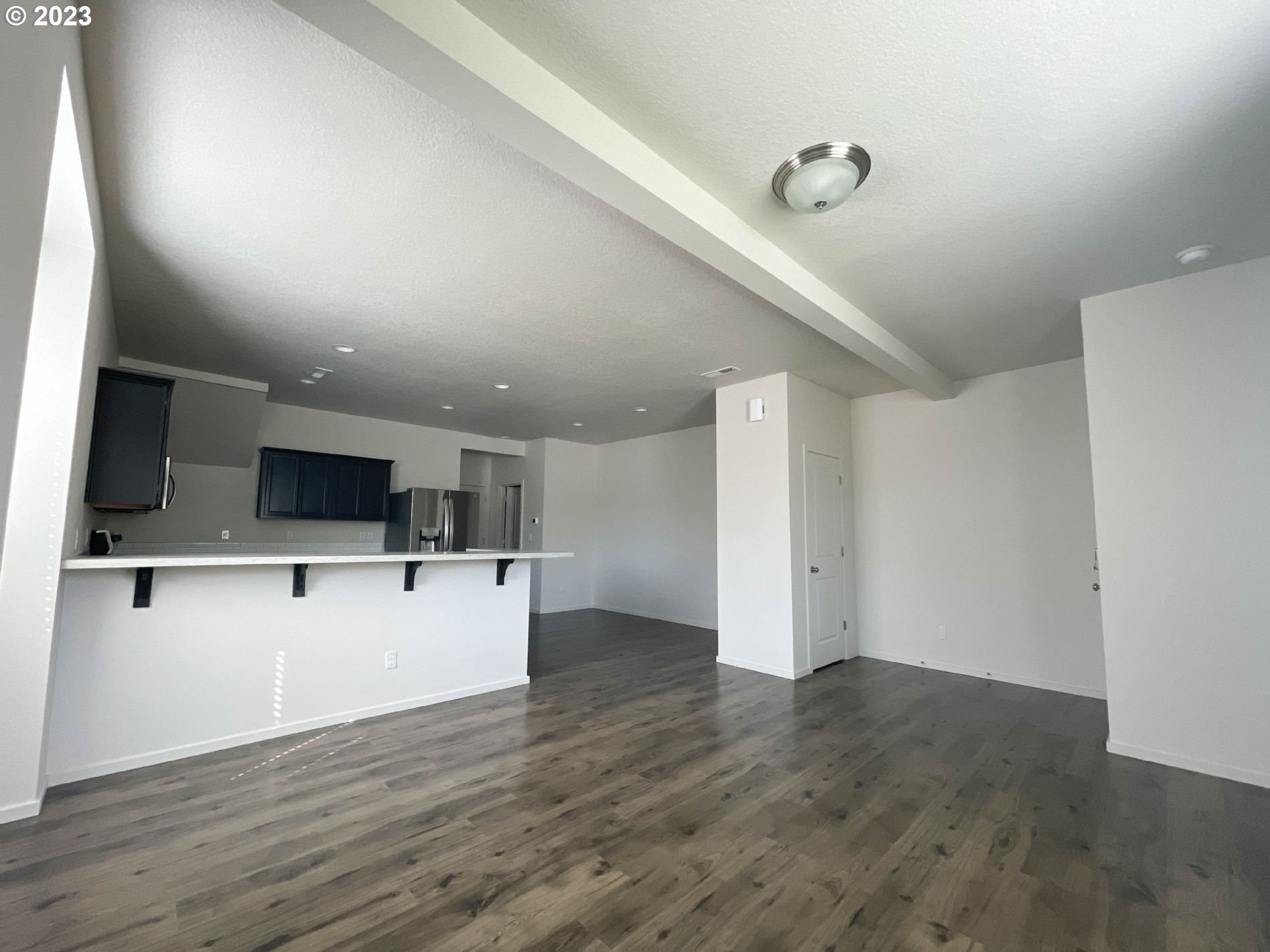 2211 Southeast 19th Street Gresham, OR 97080 - Photo 4 of 16 a view of kitchen with microwave refrigerator and stove