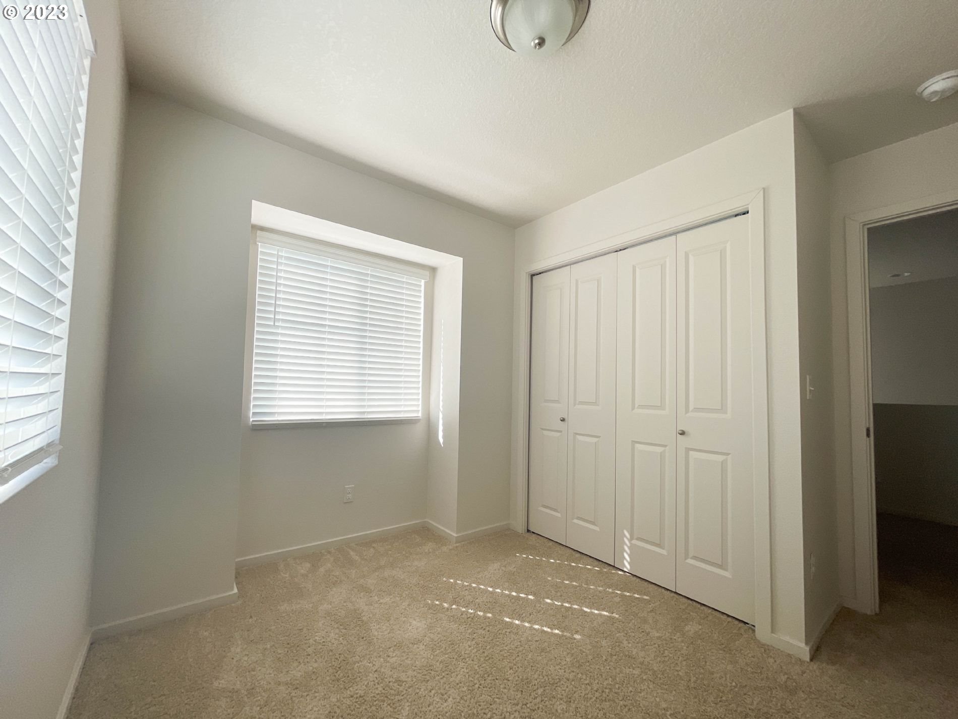 2211 Southeast 19th Street Gresham, OR 97080 - Photo 7 of 16 a view of an empty room with a window