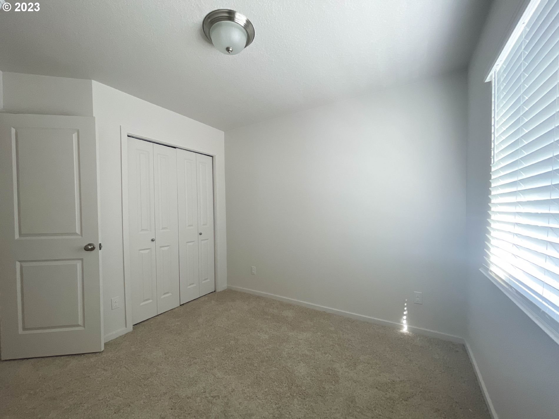 2211 Southeast 19th Street Gresham, OR 97080 - Photo 8 of 16 an empty room with windows