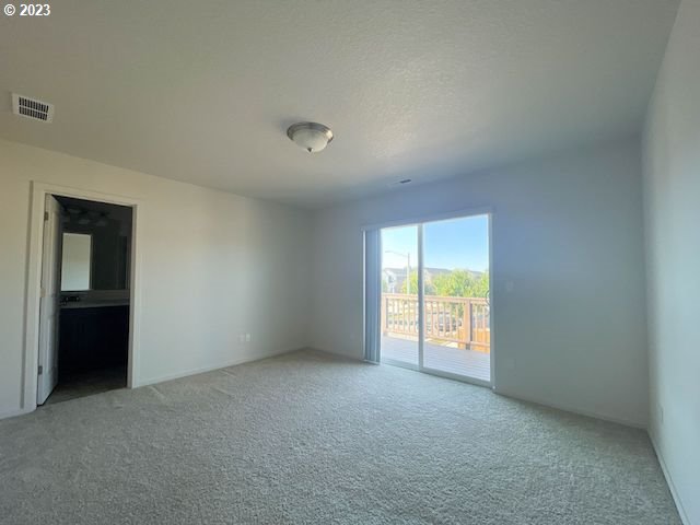 2211 Southeast 19th Street Gresham, OR 97080 - Photo 9 of 16 an empty room with windows