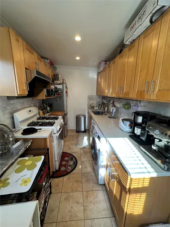 a kitchen with a stove a sink and a microwave