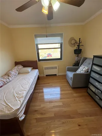 a spacious bedroom with a bed and a couch