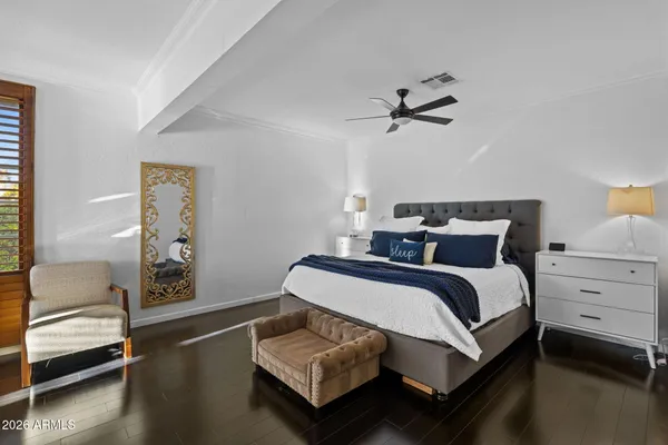 a bedroom with bed and a fireplace